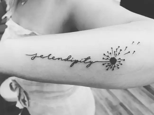 What is the hidden significance behind the serendipity tattoo?