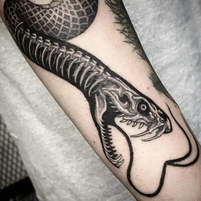 What is the symbolic meaning of a sea serpent tattoo?