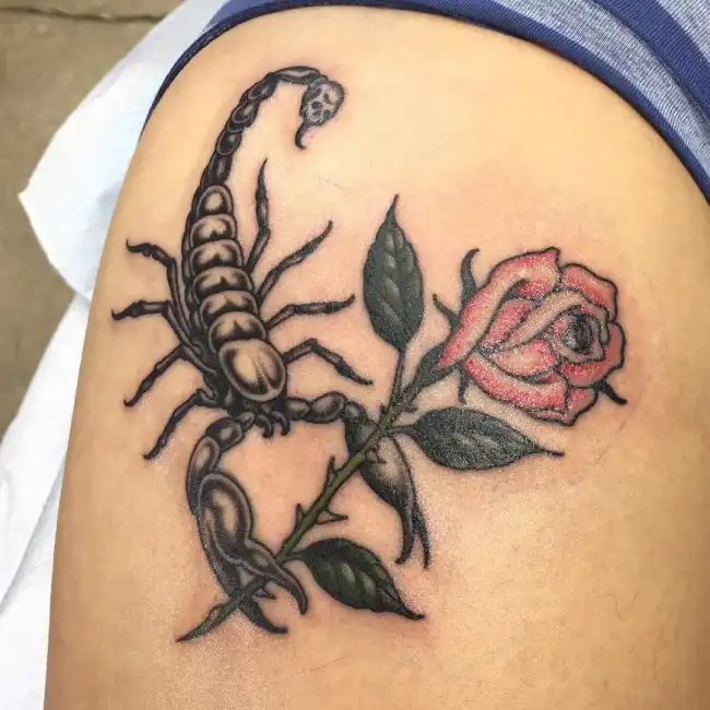 What is the symbolic meaning behind a scorpion rose tattoo?